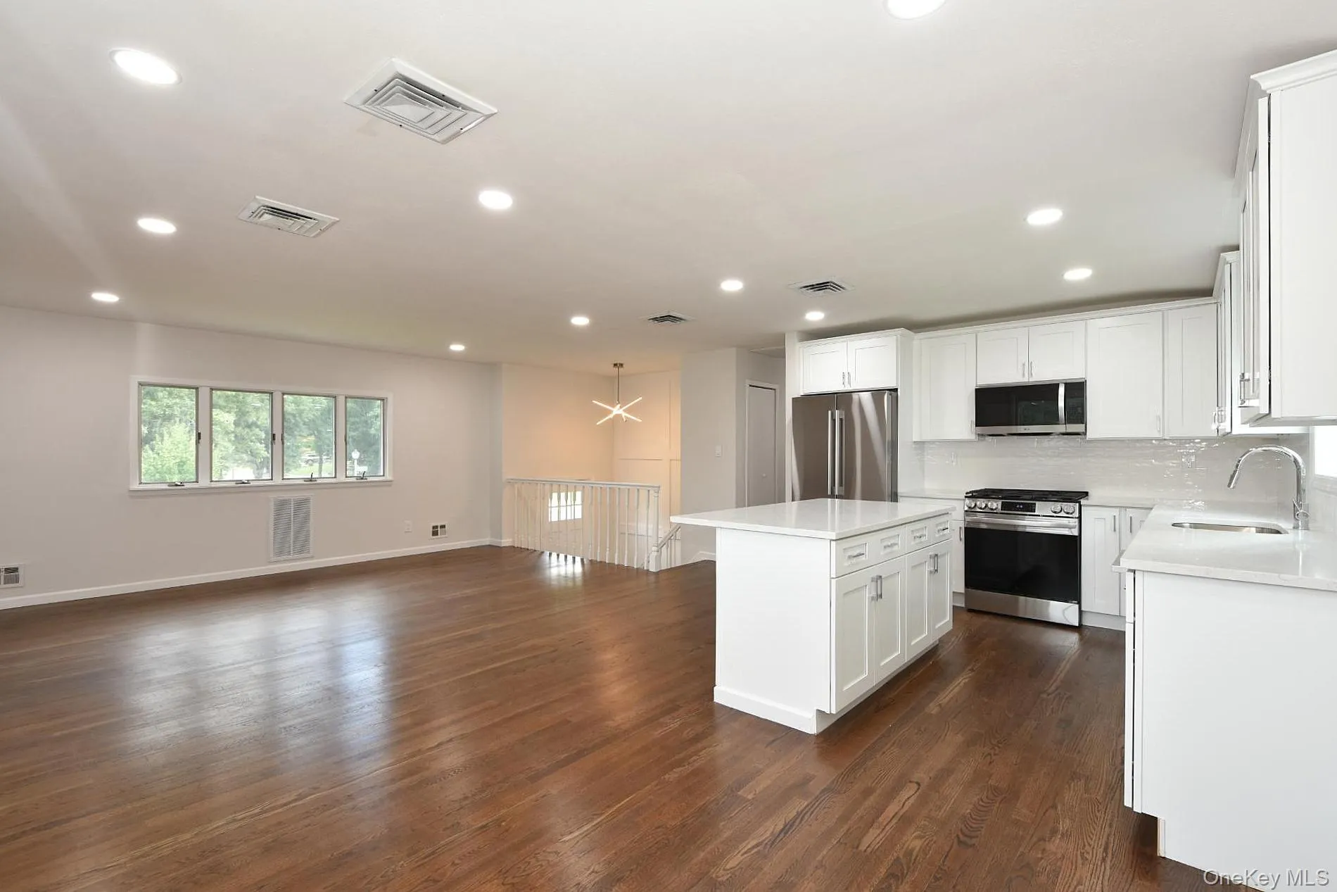 Open concept kitchen, dining area, living room with fireplace Open concept kitchen, dining area, living room with fireplace