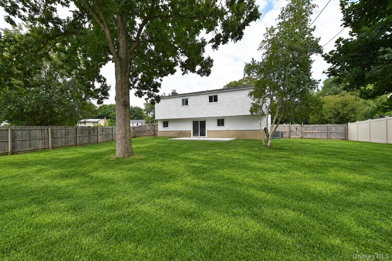 Fully fenced level backyard with new patio Fully fenced level backyard with new patio