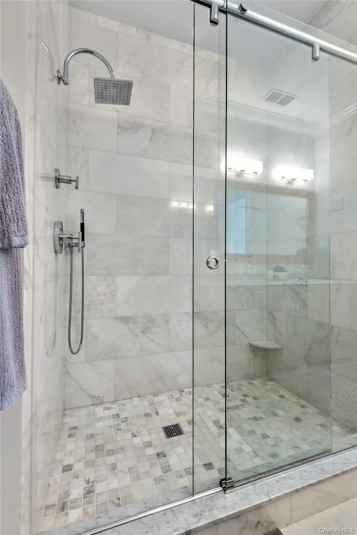 Bathroom featuring an enclosed shower Bathroom featuring an enclosed shower
