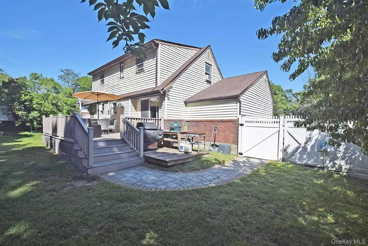 Expansive backyard featuring a multi-level deck. Expansive backyard featuring a multi-level deck.