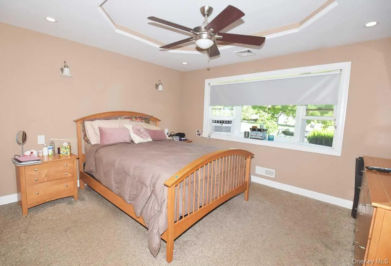 Tray ceiling with recessed lighting and a ceiling fan Tray ceiling with recessed lighting and a ceiling fan