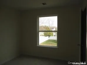 Unfurnished room with baseboards Unfurnished room with baseboards