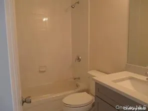 Full bathroom featuring vanity and bathtub / shower combination Full bathroom featuring vanity and bathtub / shower combination