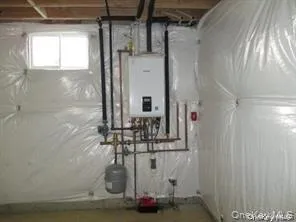 Utility room with tankless water heater Utility room with tankless water heater