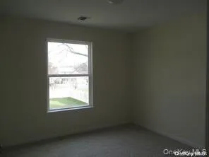 Empty room featuring plenty of natural light Empty room featuring plenty of natural light
