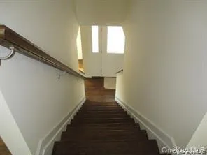 Stairway featuring baseboards Stairway featuring baseboards