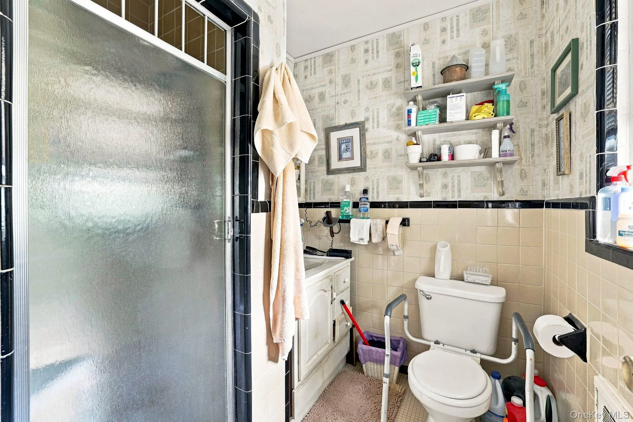 The primary bathroom includes a shower stall and window for ventilation The primary bathroom includes a shower stall and window for ventilation