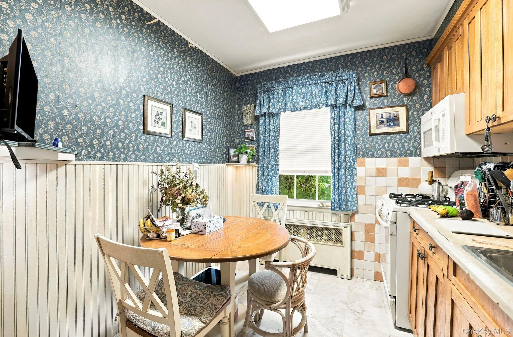 The kitchen has a gas range and east-facing window for the morning sun The kitchen has a gas range and east-facing window for the morning sun