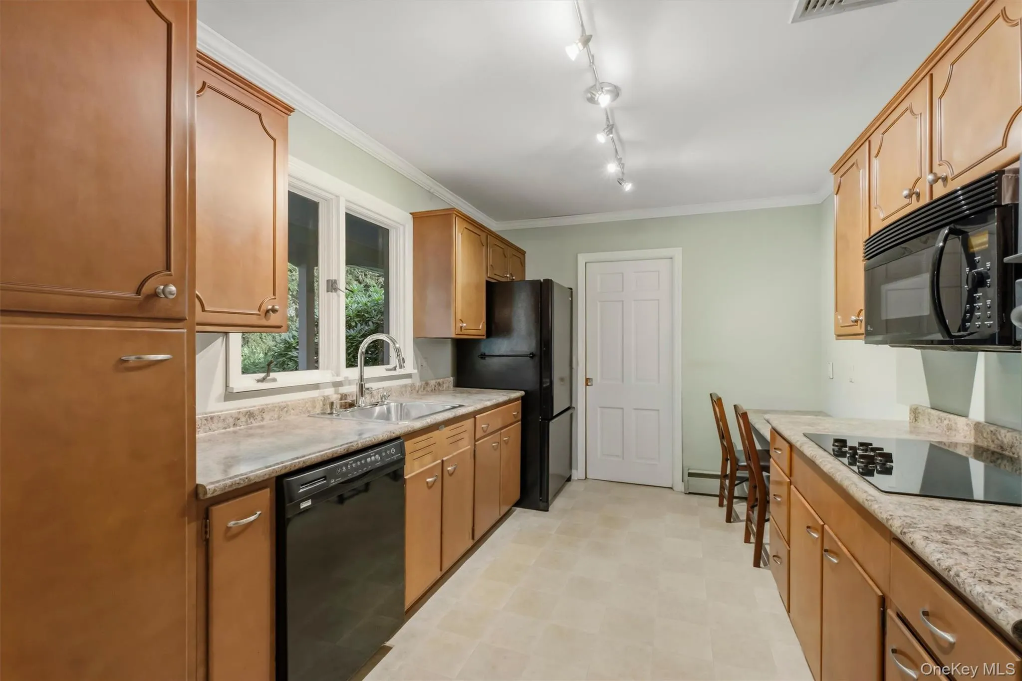 Efficient kitchen with pocket door to foyer Efficient kitchen with pocket door to foyer
