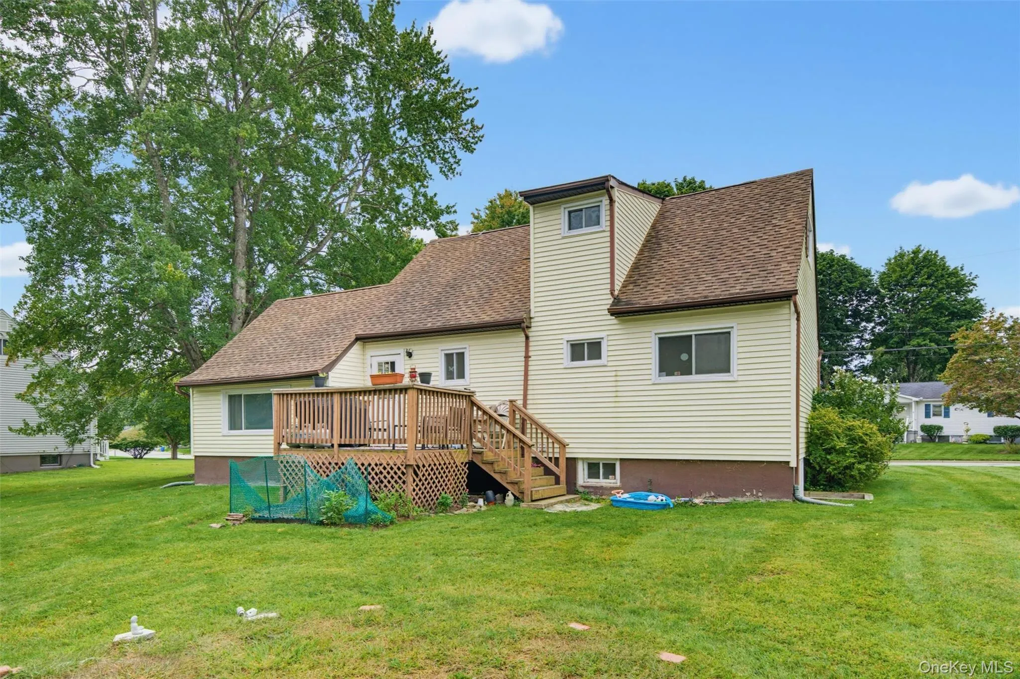 Wood deck with railing, stairs, and lattice skirting Wood deck with railing, stairs, and lattice skirting