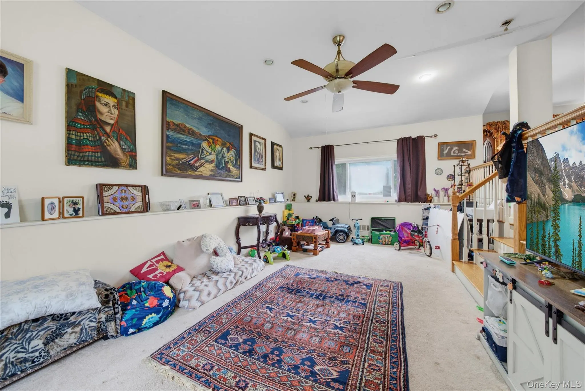 Carpeted living area featuring a ceiling fan with integrated lighting, recessed lighting Carpeted living area featuring a ceiling fan with integrated lighting, recessed lighting