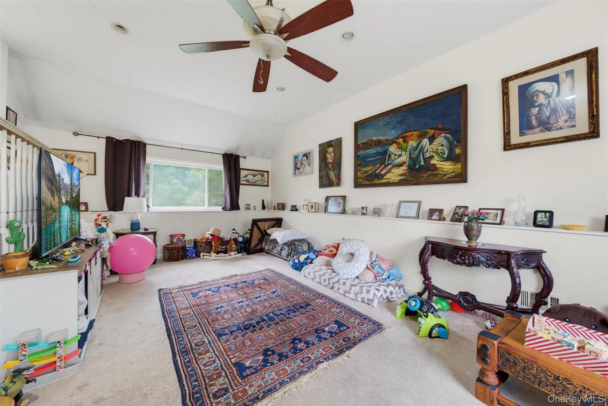 Carpeted flooring with a white sloped ceiling, recessed lighting, and a ceiling fan Carpeted flooring with a white sloped ceiling, recessed lighting, and a ceiling fan