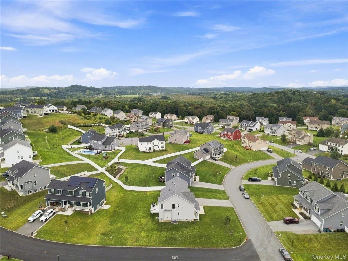Residential development featuring varied architectural styles and extensive green spaces Residential development featuring varied architectural styles and extensive green spaces