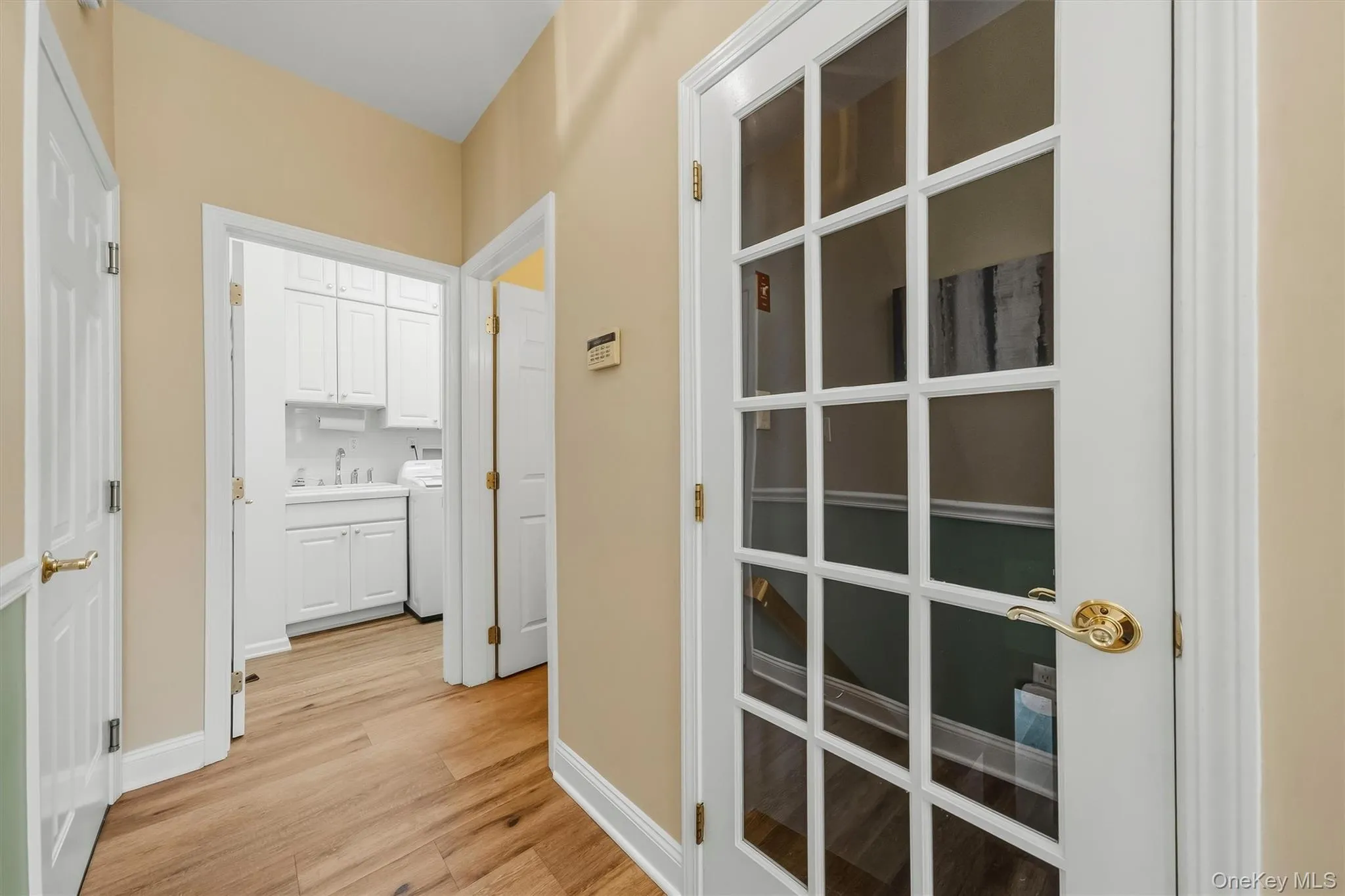 Wood-finish flooring throughout, with white trim and paneled doors Wood-finish flooring throughout, with white trim and paneled doors