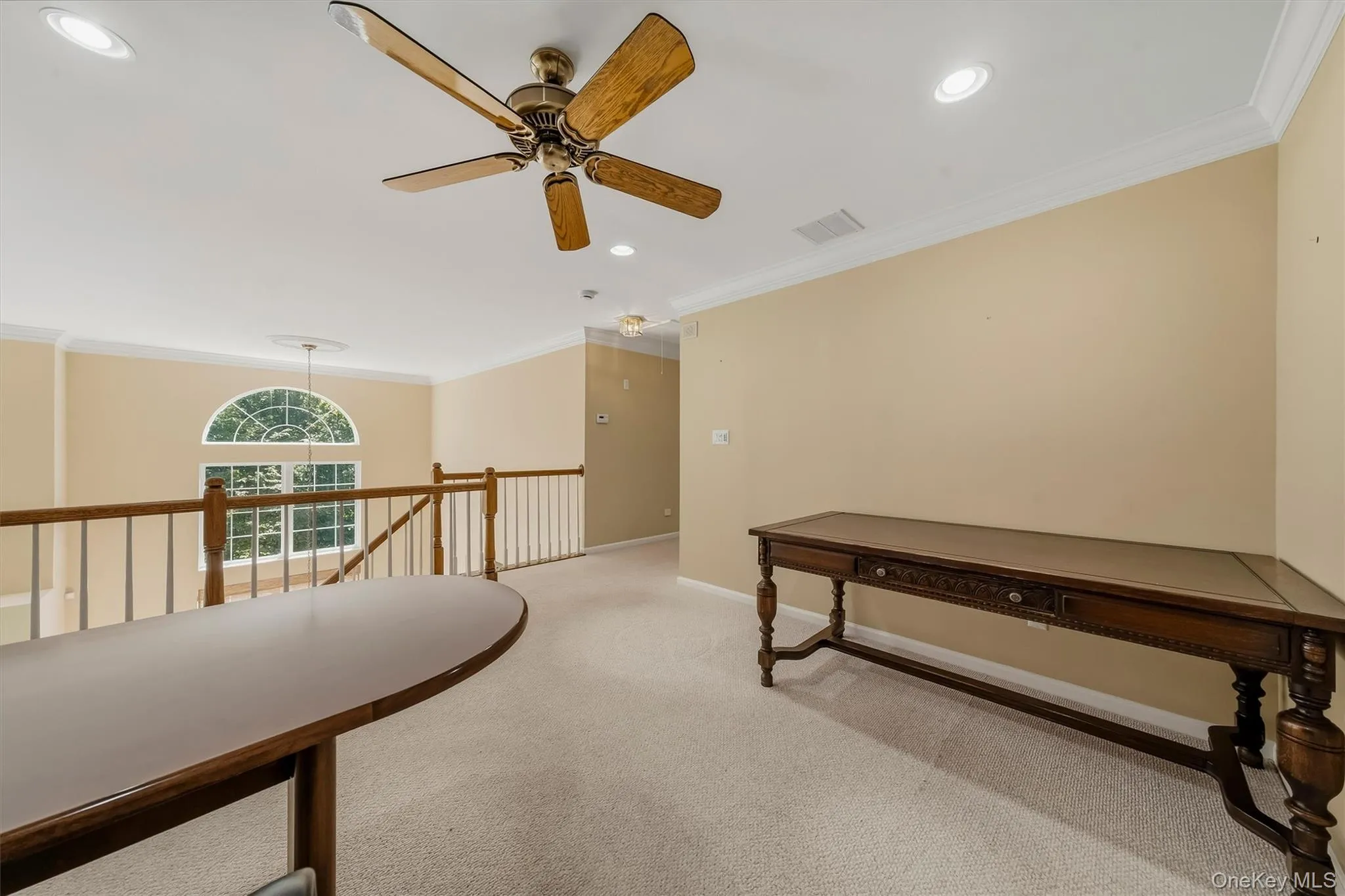 Carpeted loft area with recessed lighting, a ceiling fan, and crown molding Carpeted loft area with recessed lighting, a ceiling fan, and crown molding