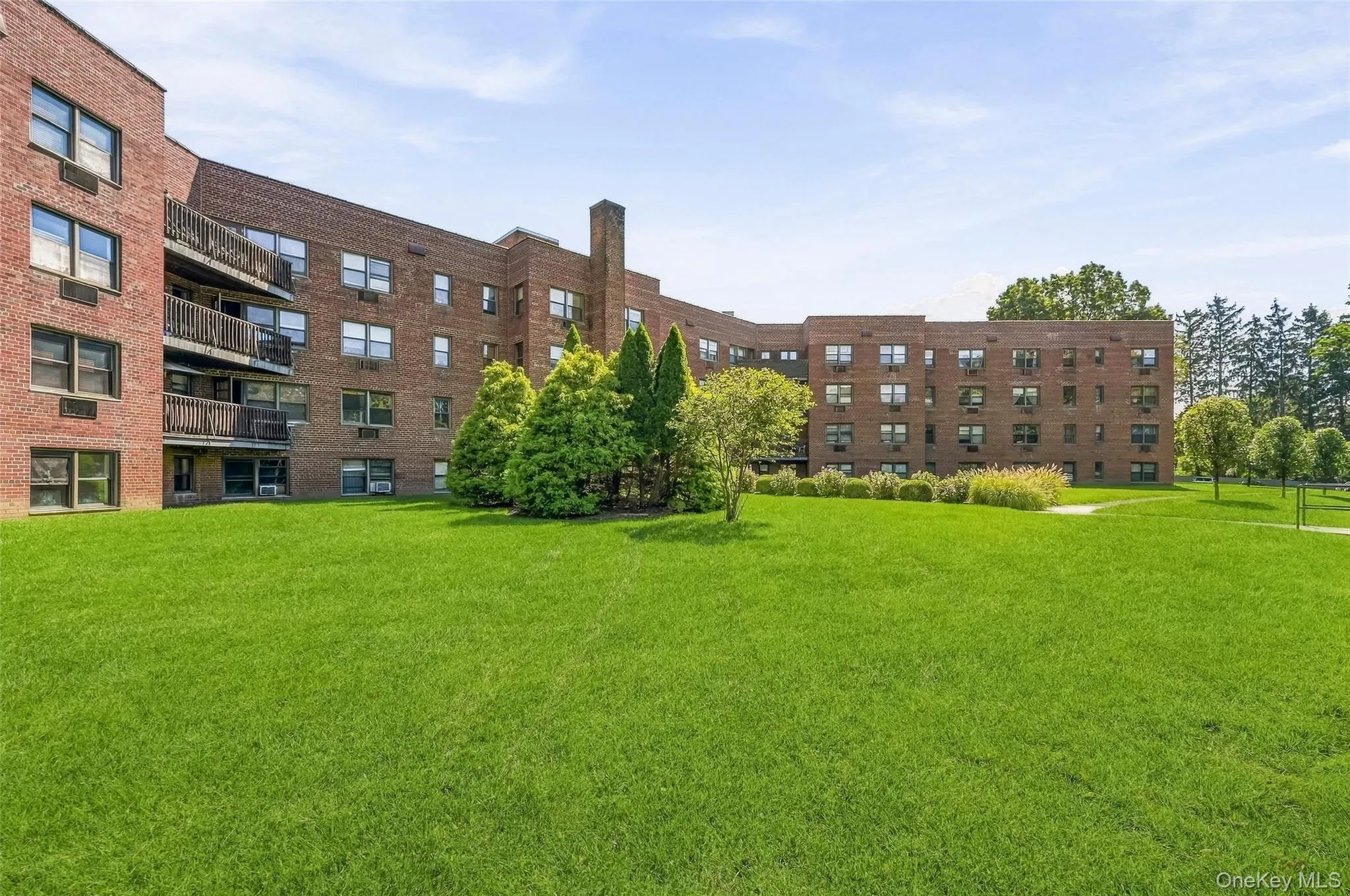 The expansive lawn gives the community an open, airy feel and offers a refreshing bit of green space. The expansive lawn gives the community an open, airy feel and offers a refreshing bit of green space.