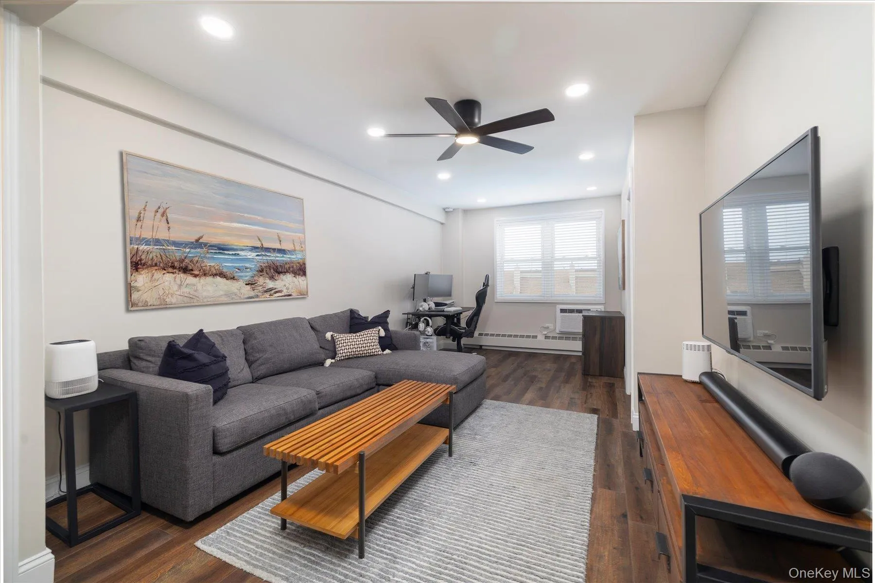 Large living space with ample natural light and recessed lighting Large living space with ample natural light and recessed lighting