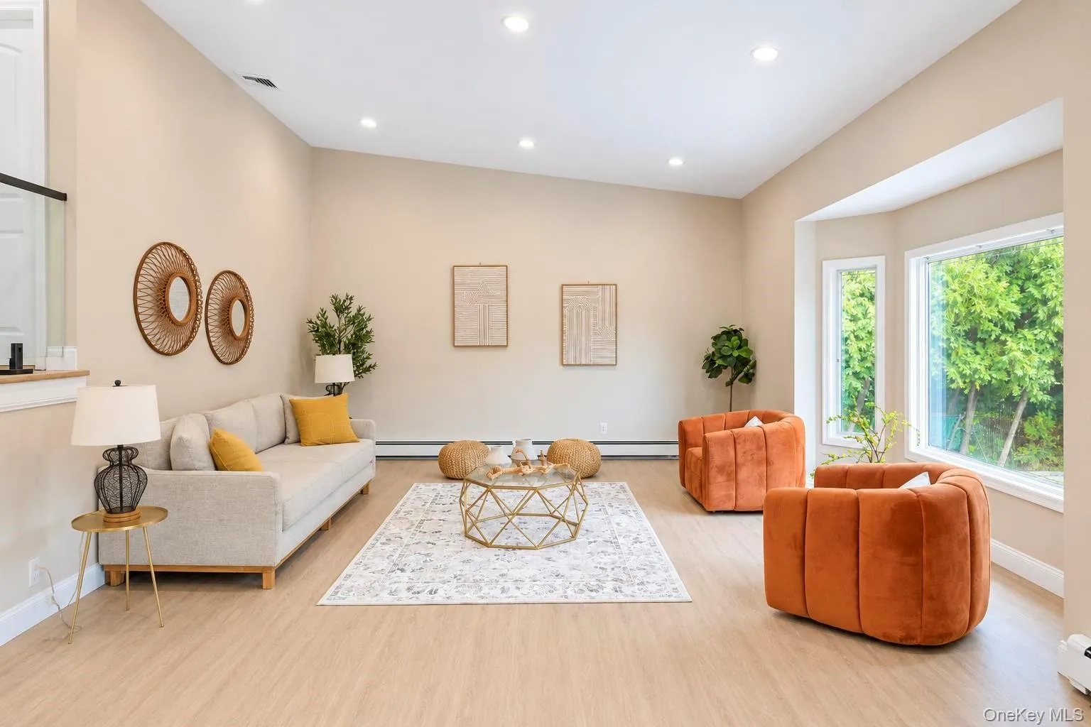 Wood-finish flooring, recessed lighting, and a bay window Wood-finish flooring, recessed lighting, and a bay window