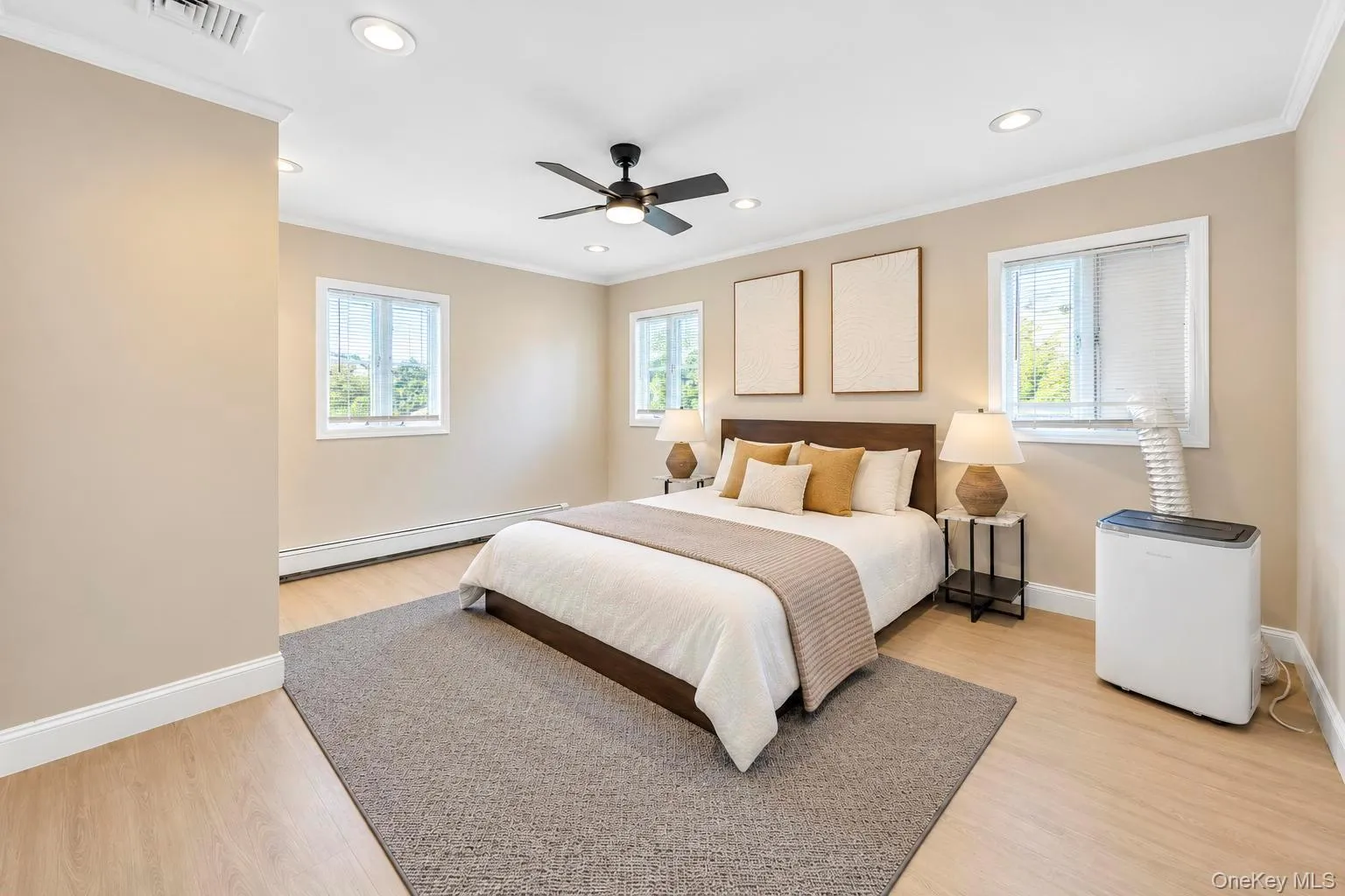Recessed lighting, ceiling fan, crown molding, wood-finish flooring, and multiple windows Recessed lighting, ceiling fan, crown molding, wood-finish flooring, and multiple windows