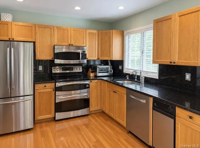 Eat in kitchen with stainless steel appliances Eat in kitchen with stainless steel appliances