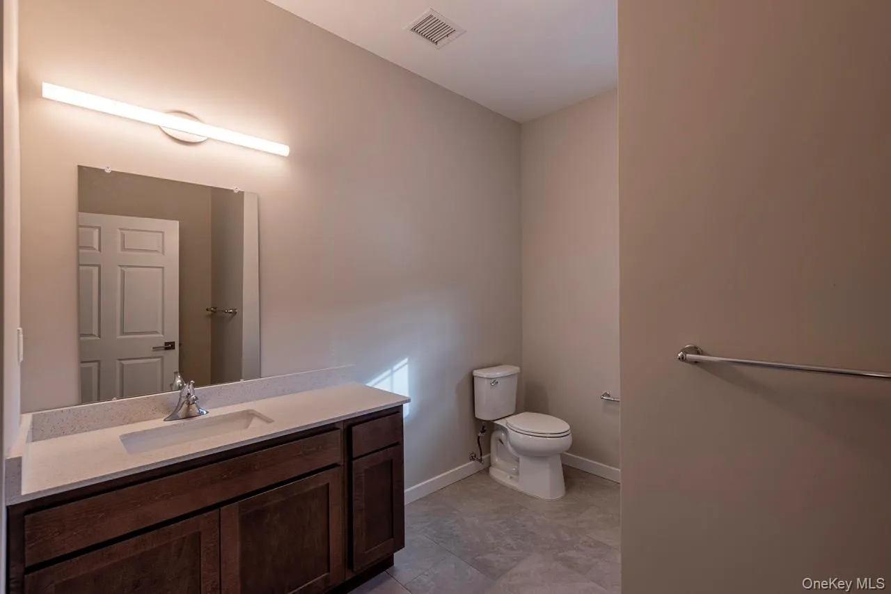 Representative bathroom showing finishes and fixtures at Zero Place. Representative bathroom showing finishes and fixtures at Zero Place.