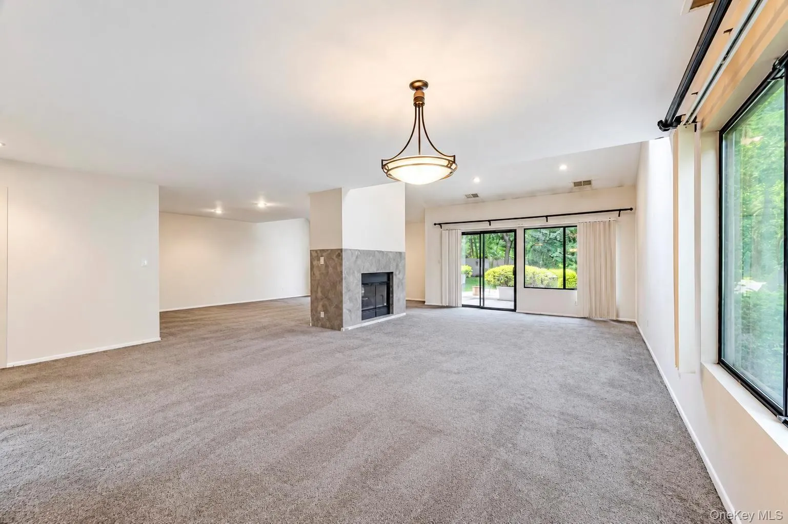 Open Floor Plan; Dining Area, Living Room and Den w/double sided fireplace and 2 sets of glass sliders to patio area Open Floor Plan; Dining Area, Living Room and Den w/double sided fireplace and 2 sets of glass sliders to patio area