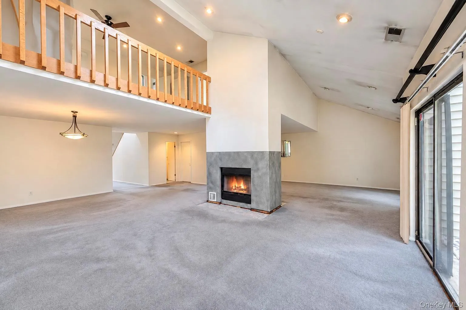 Open Floor Plan; Dining Area, Living Room and Den w/double sided fireplace, high vaulted ceilings and 2 sets of glass sliders to patio area Open Floor Plan; Dining Area, Living Room and Den w/double sided fireplace, high vaulted ceilings and 2 sets of glass sliders to patio area
