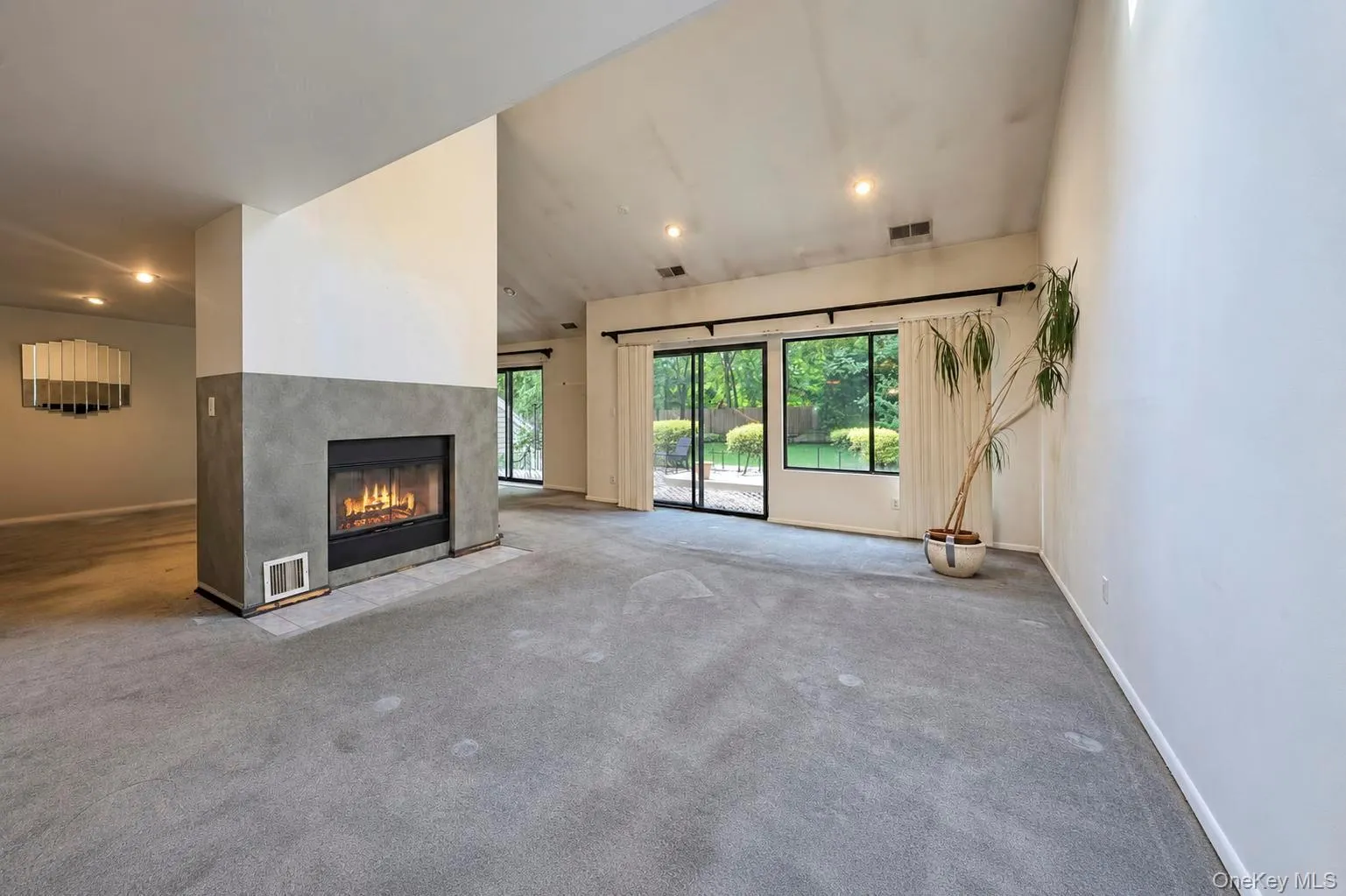 Open Floor Plan; Dining Area, Living Room and Den w/double sided fireplace, high vaulted ceilings and 2 sets of glass sliders to patio area Open Floor Plan; Dining Area, Living Room and Den w/double sided fireplace, high vaulted ceilings and 2 sets of glass sliders to patio area