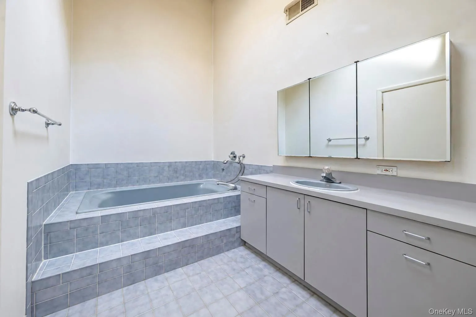 Primary bathroom with high vaulted ceiling, skylight, standalone jetted tub, large vanity and separate standalone stall shower Primary bathroom with high vaulted ceiling, skylight, standalone jetted tub, large vanity and separate standalone stall shower