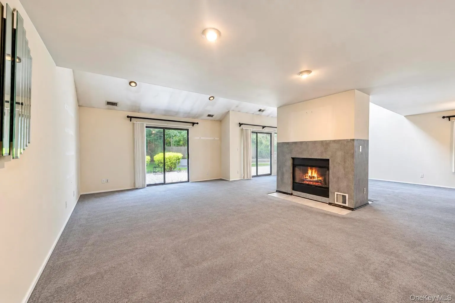 Open Floor Plan; Dining Area, Living Room and Den w/double sided fireplace, high vaulted ceilings and 2 sets of glass sliders to patio area Open Floor Plan; Dining Area, Living Room and Den w/double sided fireplace, high vaulted ceilings and 2 sets of glass sliders to patio area