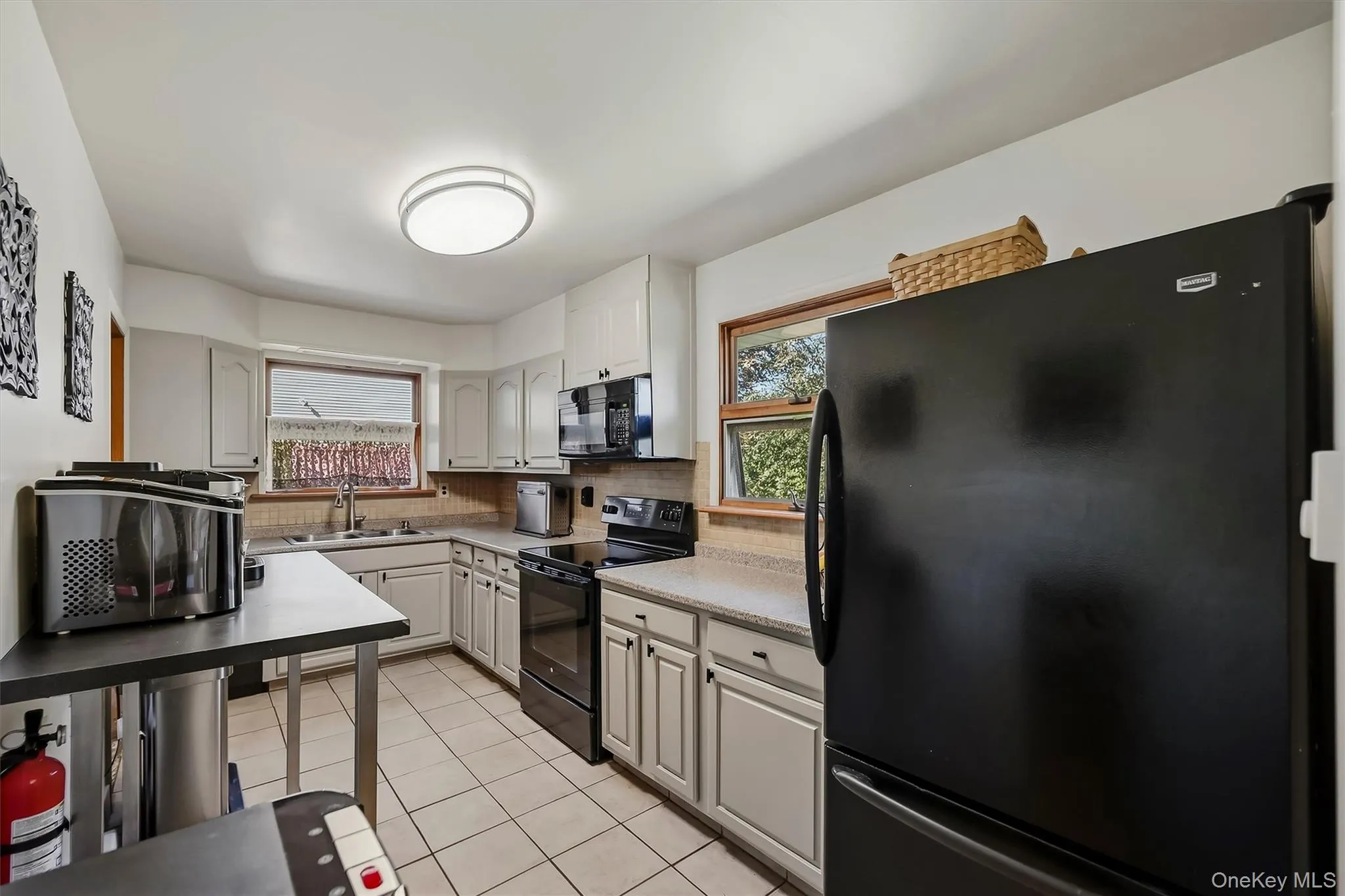 Updated kitchen with plenty of cabinetry and counter space Updated kitchen with plenty of cabinetry and counter space