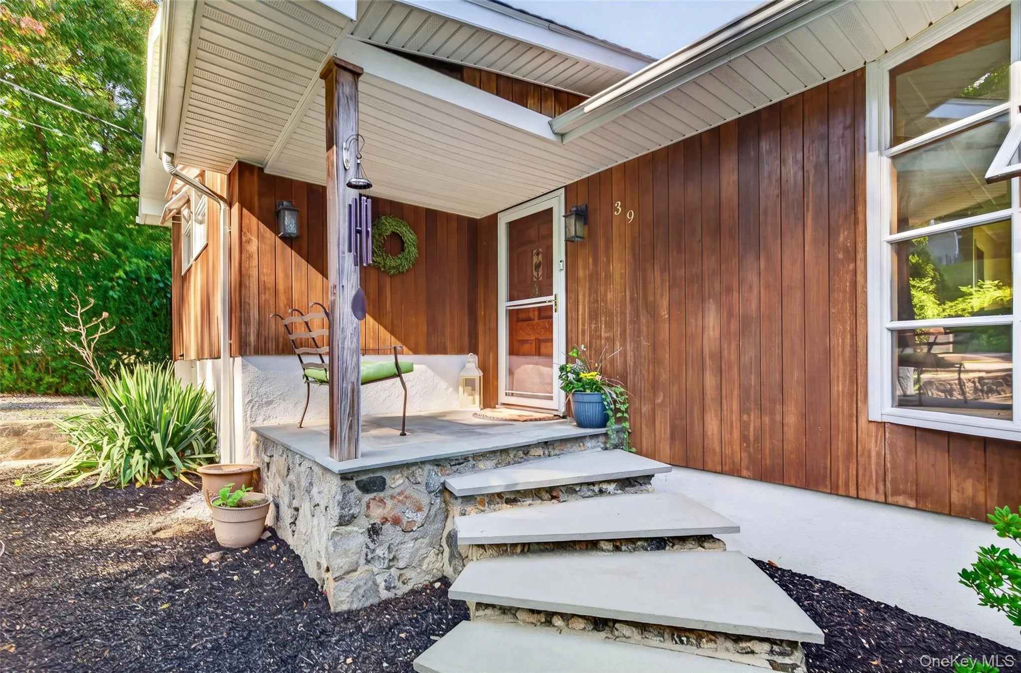 The front steps gracefully ascend to the covered entry The front steps gracefully ascend to the covered entry