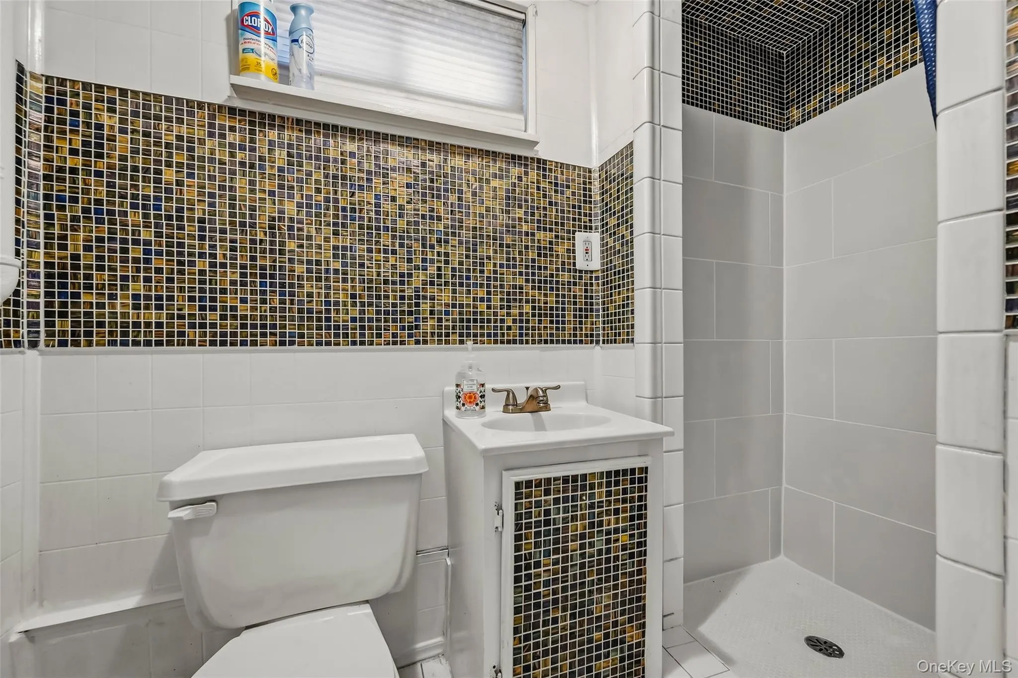 Updated fully tiled lower level bathroom Updated fully tiled lower level bathroom