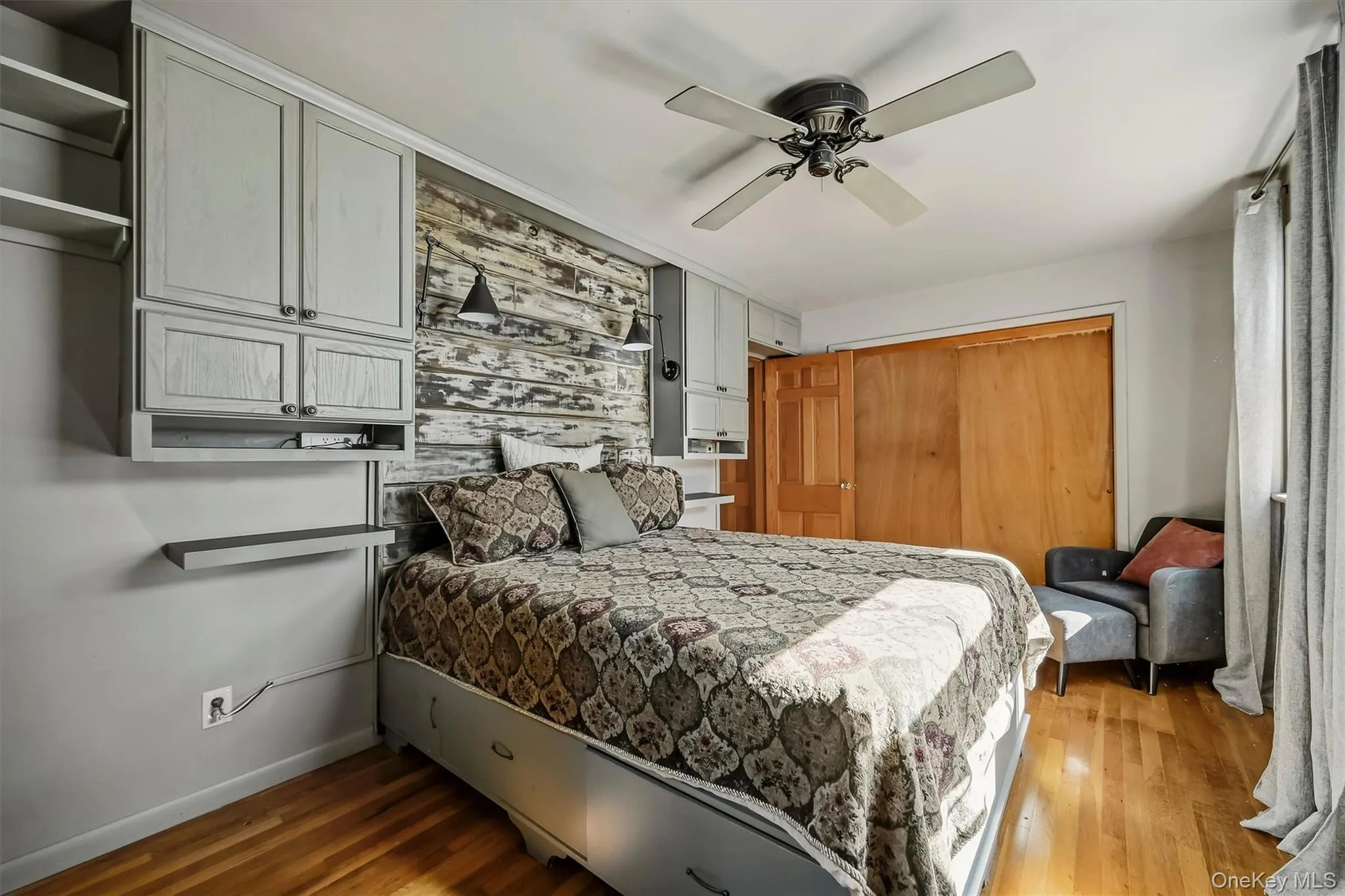 Featuring a ceiling fan and double closets Featuring a ceiling fan and double closets