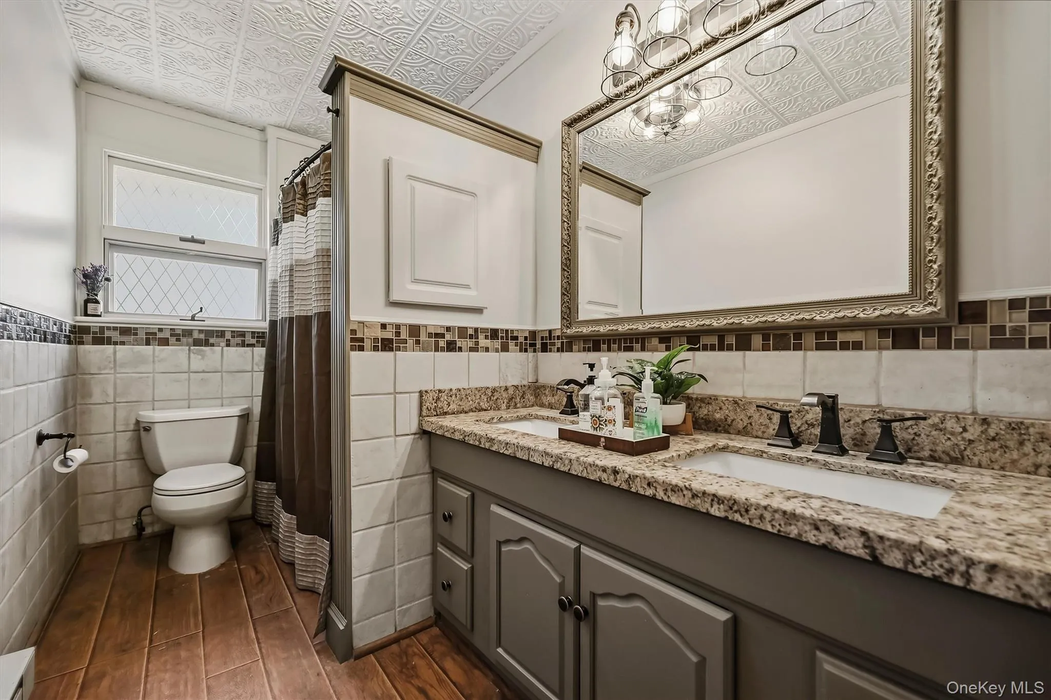 High end custom finishes: granite counter with double inlay sinks, upscale lighting, wood style flooring and tiled backsplash. High end custom finishes: granite counter with double inlay sinks, upscale lighting, wood style flooring and tiled backsplash.