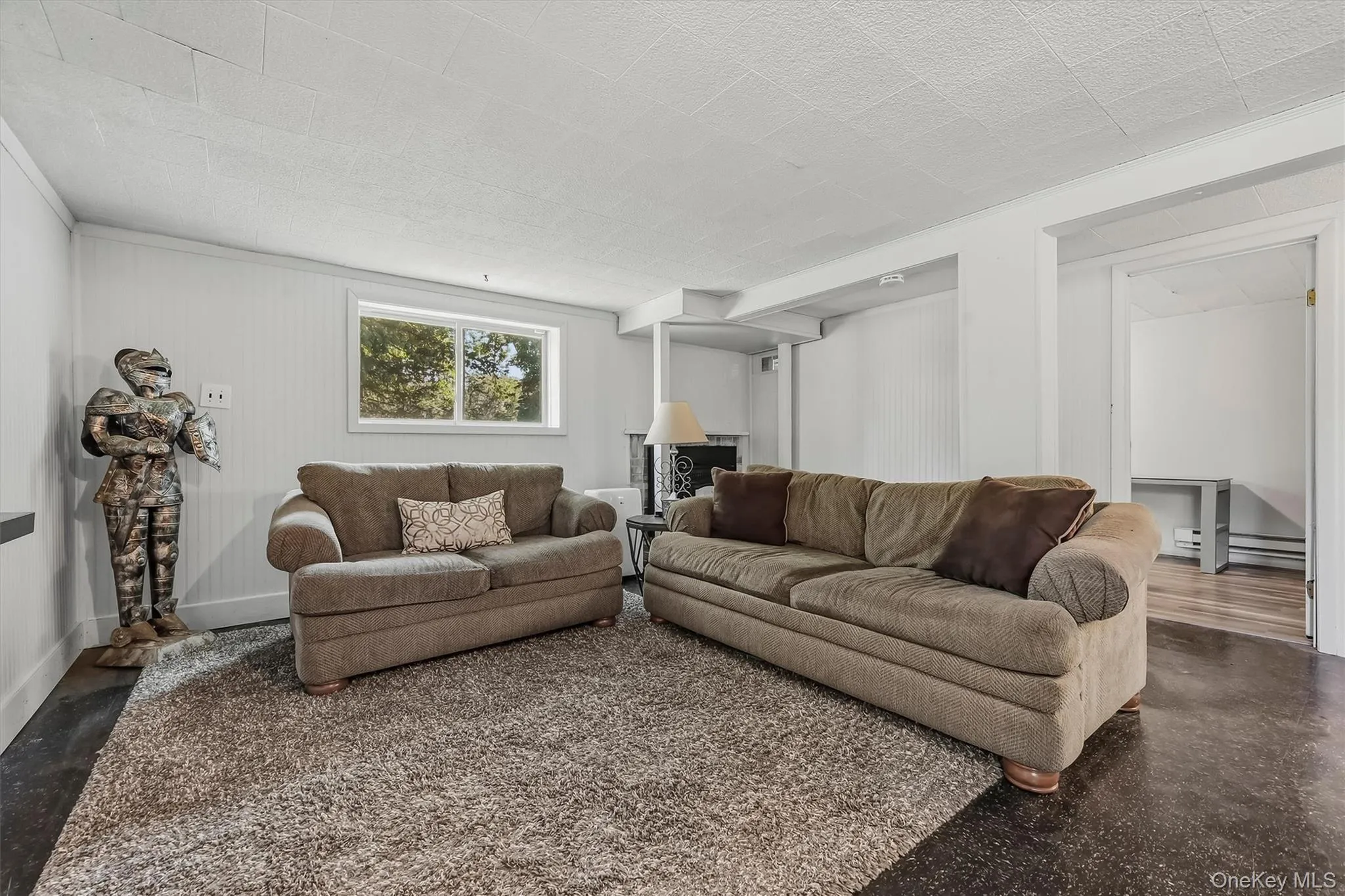 Spacious family room with vinyl flooring Spacious family room with vinyl flooring