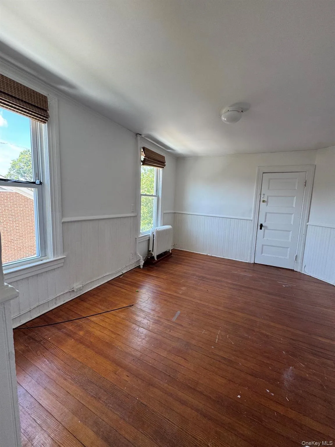 living room is conveniently located in the center of the apt living room is conveniently located in the center of the apt