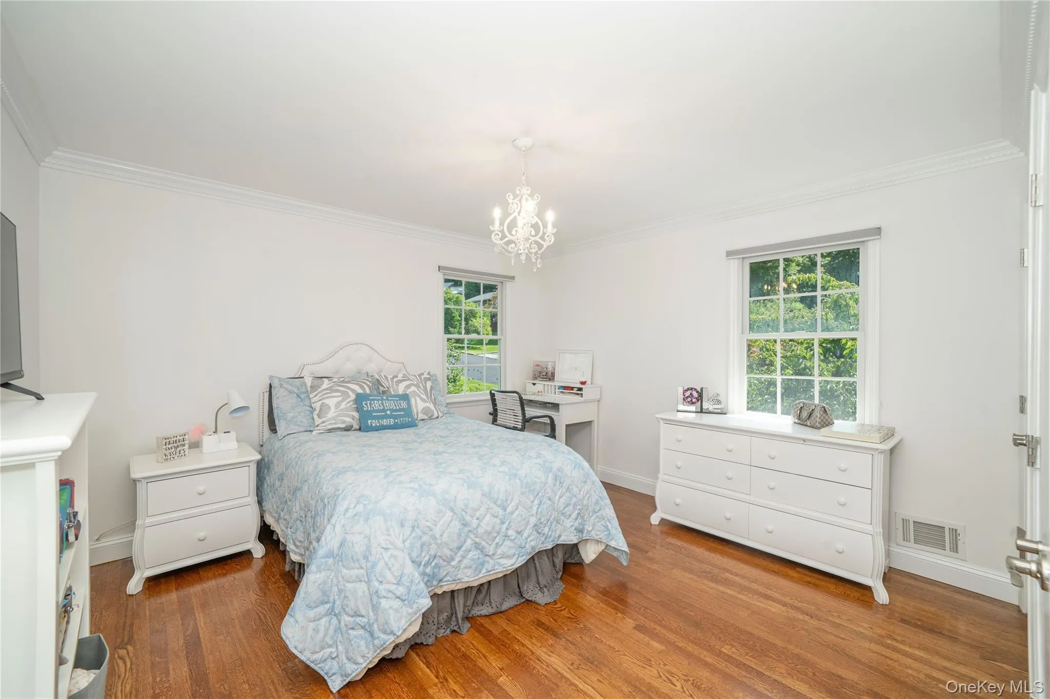 A bright, well-proportioned second bedroom offers generous space for furnishings and excellent natural light. A bright, well-proportioned second bedroom offers generous space for furnishings and excellent natural light.