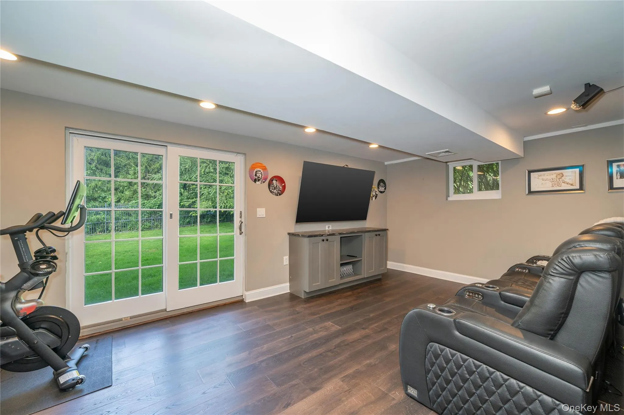 This versatile recreation space offers room for exercise, hobbies and more, with glass doors bring in natural light and providing direct walk-out access to the patio and hot tub. This versatile recreation space offers room for exercise, hobbies and more, with glass doors bring in natural light and providing direct walk-out access to the patio and hot tub.