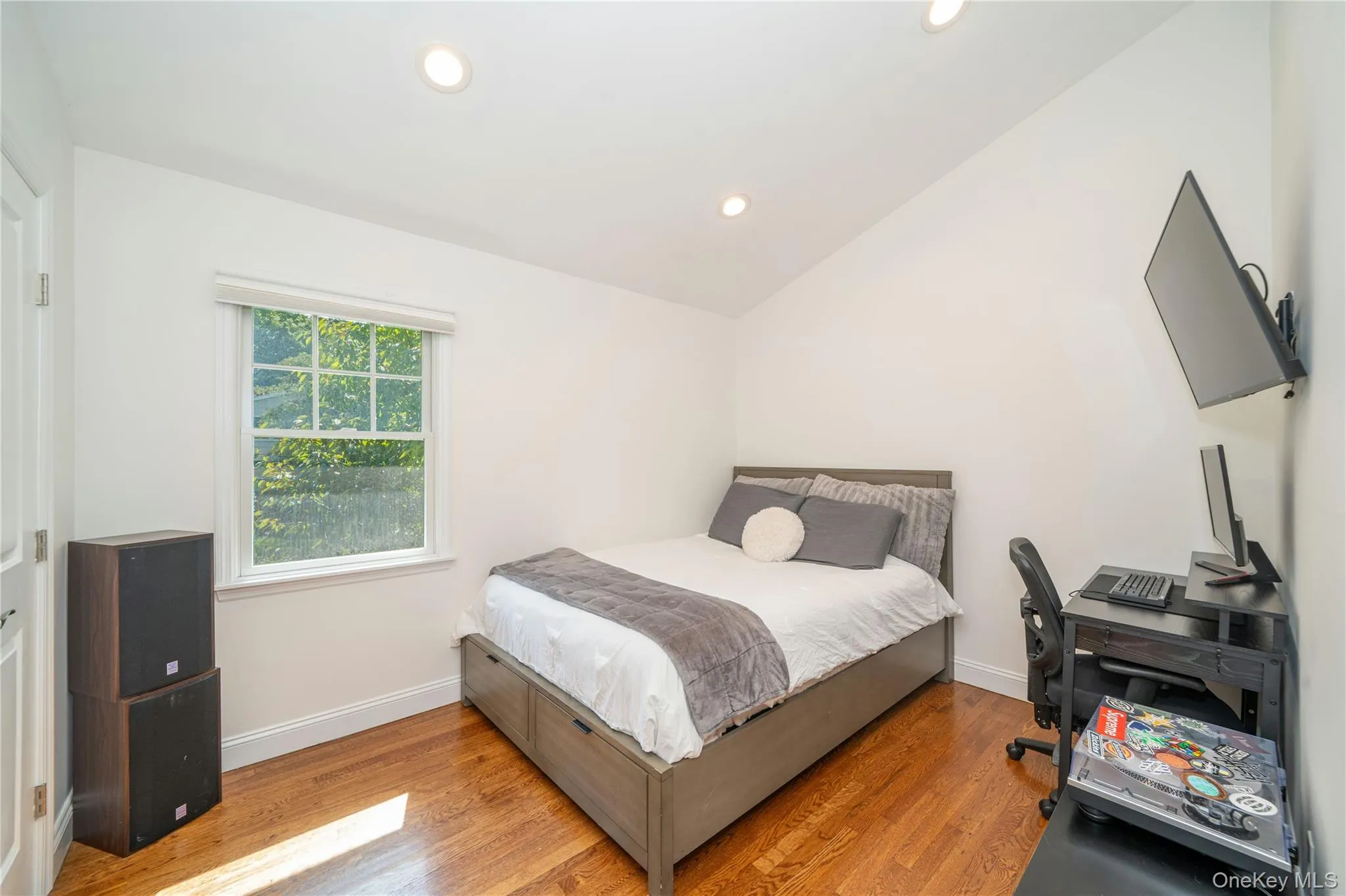 The third bedroom features a vaulted ceiling, adding a wonderful sense of height and architectural interest to the space. The third bedroom features a vaulted ceiling, adding a wonderful sense of height and architectural interest to the space.