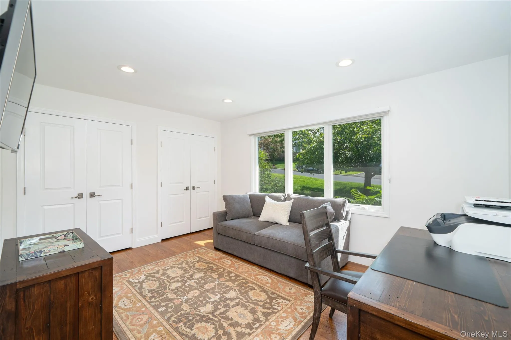 Currently used as a home office, the fourth bedroom offers excellent flexibility, with a large window and two double closets featuring custom built-ins. Currently used as a home office, the fourth bedroom offers excellent flexibility, with a large window and two double closets featuring custom built-ins.