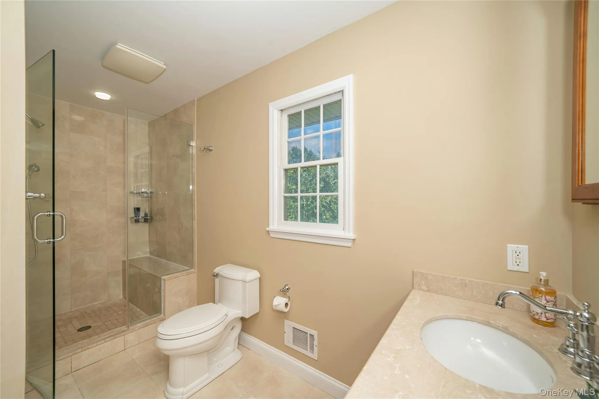 This alternate view highlights the separate glass-enclosed shower, completing the en-suite primary bath with its double-sink vanity and jetted soaking tub. This alternate view highlights the separate glass-enclosed shower, completing the en-suite primary bath with its double-sink vanity and jetted soaking tub.