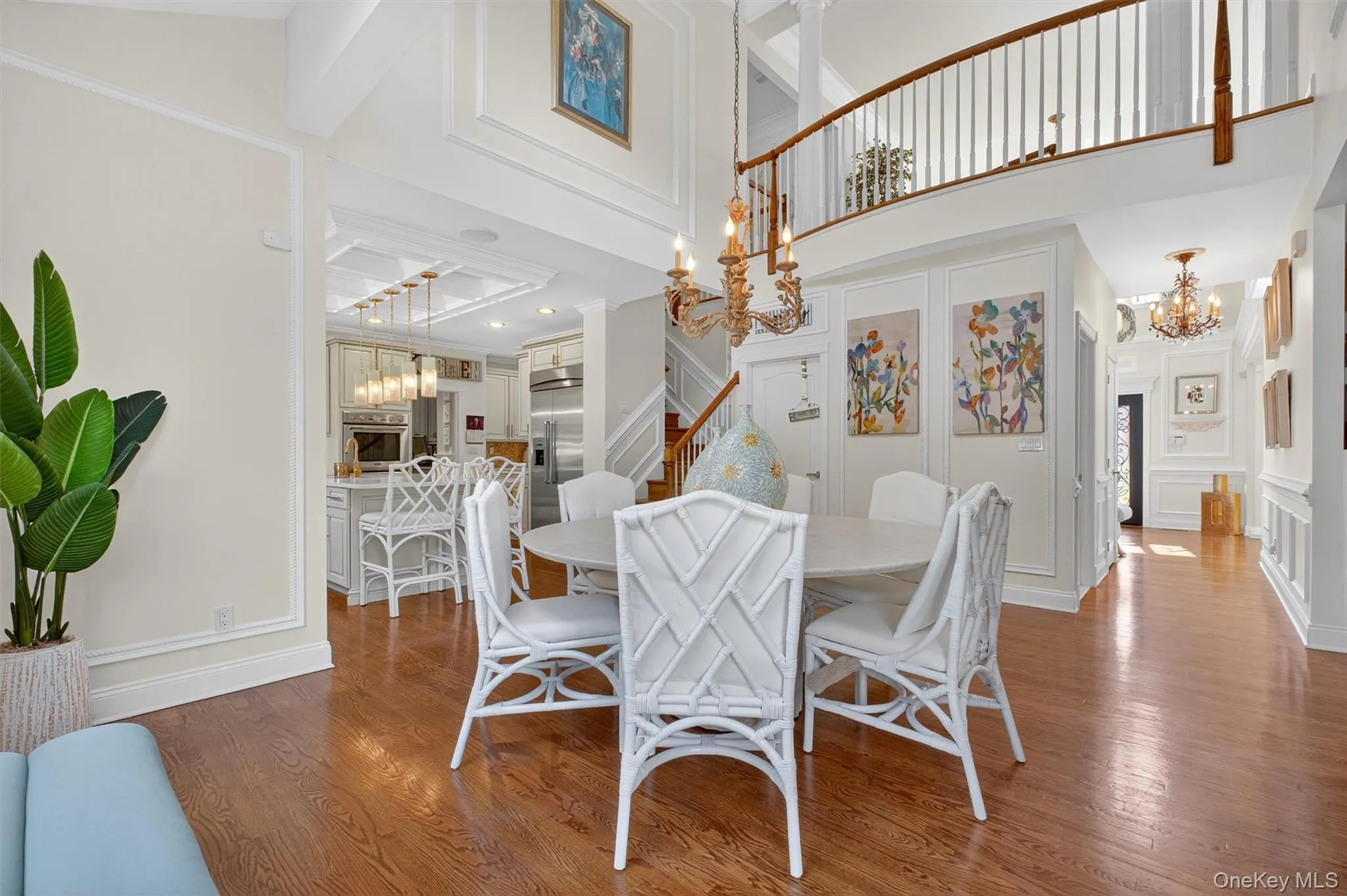 This breathtaking eat-in space serves as the true hub of the home, effortlessly linking the front hall, family room, and kitchen, while offering the convenience of a secondary staircase to the upper level. With its dramatic ceiling height and expansive wall of windows, it balances everyday functionality with a sense of grandeur—making it as practical as it is unforgettable. This breathtaking eat-in space serves as the true hub of the home, effortlessly linking the front hall, family room, and kitchen, while offering the convenience of a secondary staircase to the upper level. With its dramatic ceiling height and expansive wall of windows, it balances everyday functionality with a sense of grandeur—making it as practical as it is unforgettable.