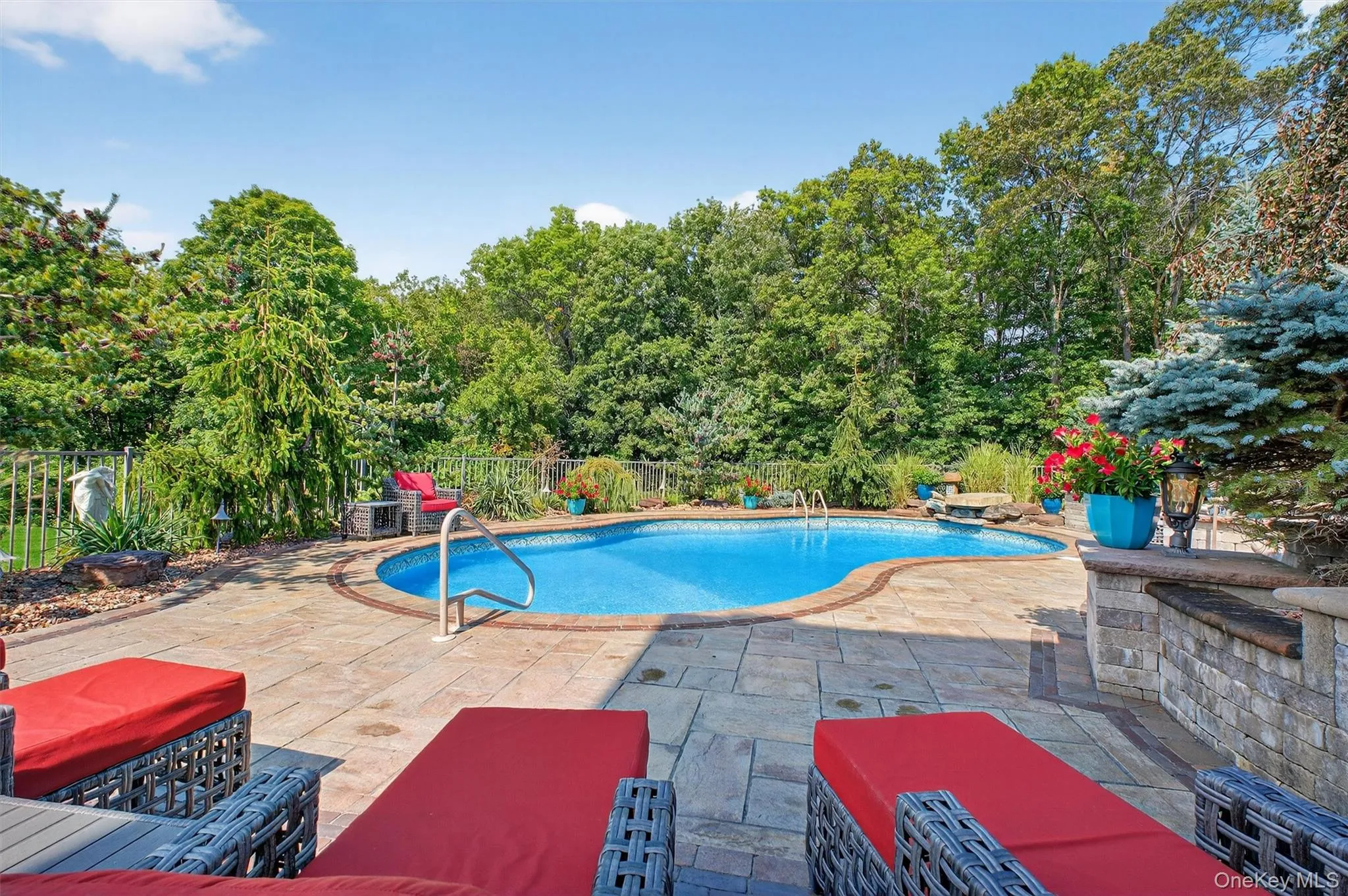The lower-level walkout, the pool unfolds like a luxury oasis, designed for entertaining and indulgence. The heated saltwater pool, with its distinctive heart shape, feels like something out of Shangri-La, with natural stone accents enhancing its serene vibe. Surrounded by expansive stove patios, this area offers multiple zones for lounging, sunbathing, or hosting poolside gatherings. Whether it’s an intimate evening swim or a lively summer party, this backyard retreat delivers a true five-star resort experience—all from the comfort of home. The lower-level walkout, the pool unfolds like a luxury oasis, designed for entertaining and indulgence. The heated saltwater pool, with its distinctive heart shape, feels like something out of Shangri-La, with natural stone accents enhancing its serene vibe. Surrounded by expansive stove patios, this area offers multiple zones for lounging, sunbathing, or hosting poolside gatherings. Whether it’s an intimate evening swim or a lively summer party, this backyard retreat delivers a true five-star resort experience—all from the comfort of home.