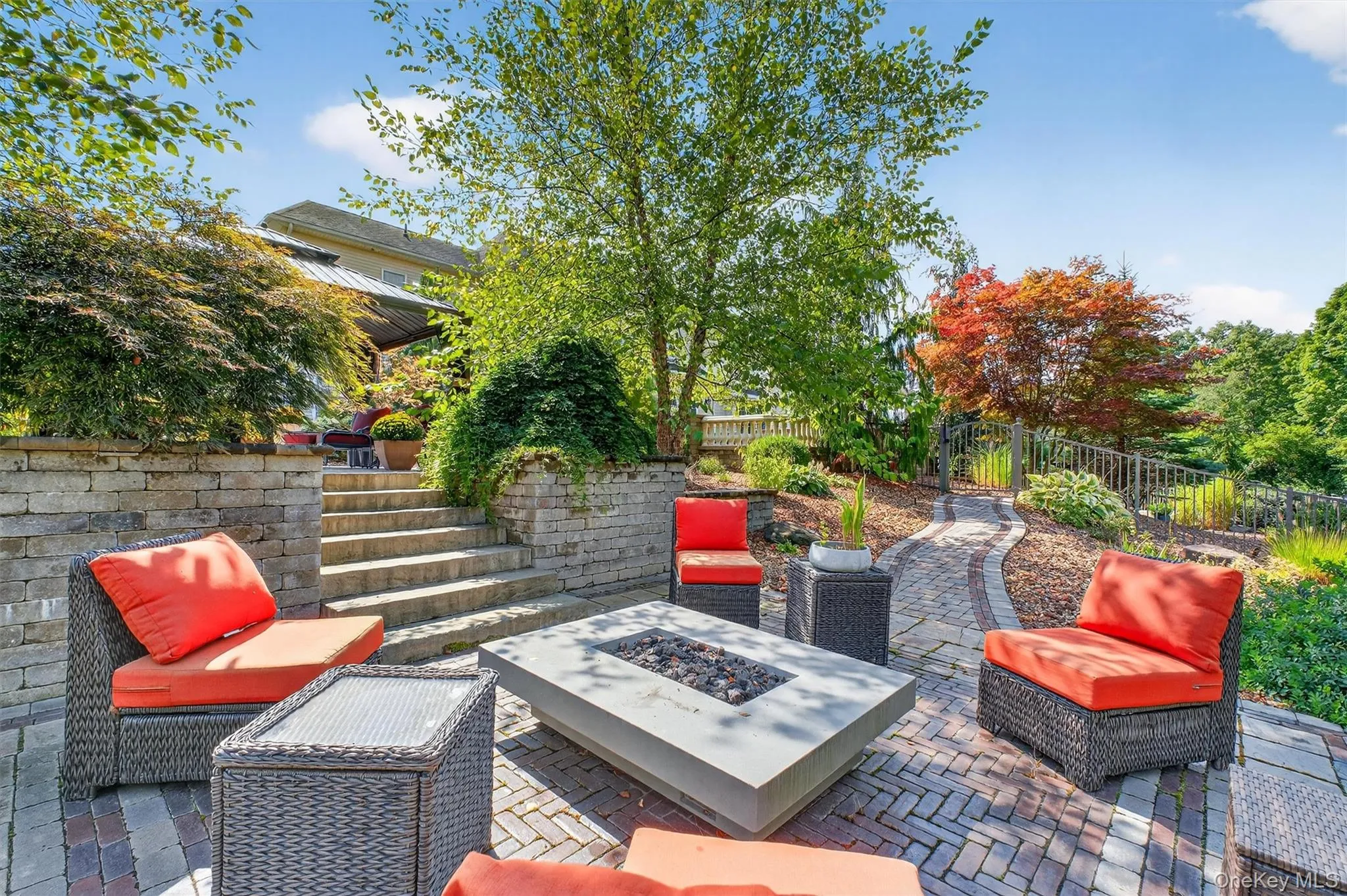 Resort-style living comes to life around this stone firepit patio, where design and function meet in perfect harmony. Crafted for both intimate evenings and lively gatherings, this inviting space offers warmth, ambiance, and complete privacy. The low-maintenance stonework ensures lasting beauty, while its seamless connection to the surrounding patios makes entertaining effortless. Whether roasting marshmallows under the stars, sipping wine fireside, or simply enjoying the serenity of nature, this firepit retreat is a destination in itself—an outdoor haven designed for endless enjoyment. Resort-style living comes to life around this stone firepit patio, where design and function meet in perfect harmony. Crafted for both intimate evenings and lively gatherings, this inviting space offers warmth, ambiance, and complete privacy. The low-maintenance stonework ensures lasting beauty, while its seamless connection to the surrounding patios makes entertaining effortless. Whether roasting marshmallows under the stars, sipping wine fireside, or simply enjoying the serenity of nature, this firepit retreat is a destination in itself—an outdoor haven designed for endless enjoyment.