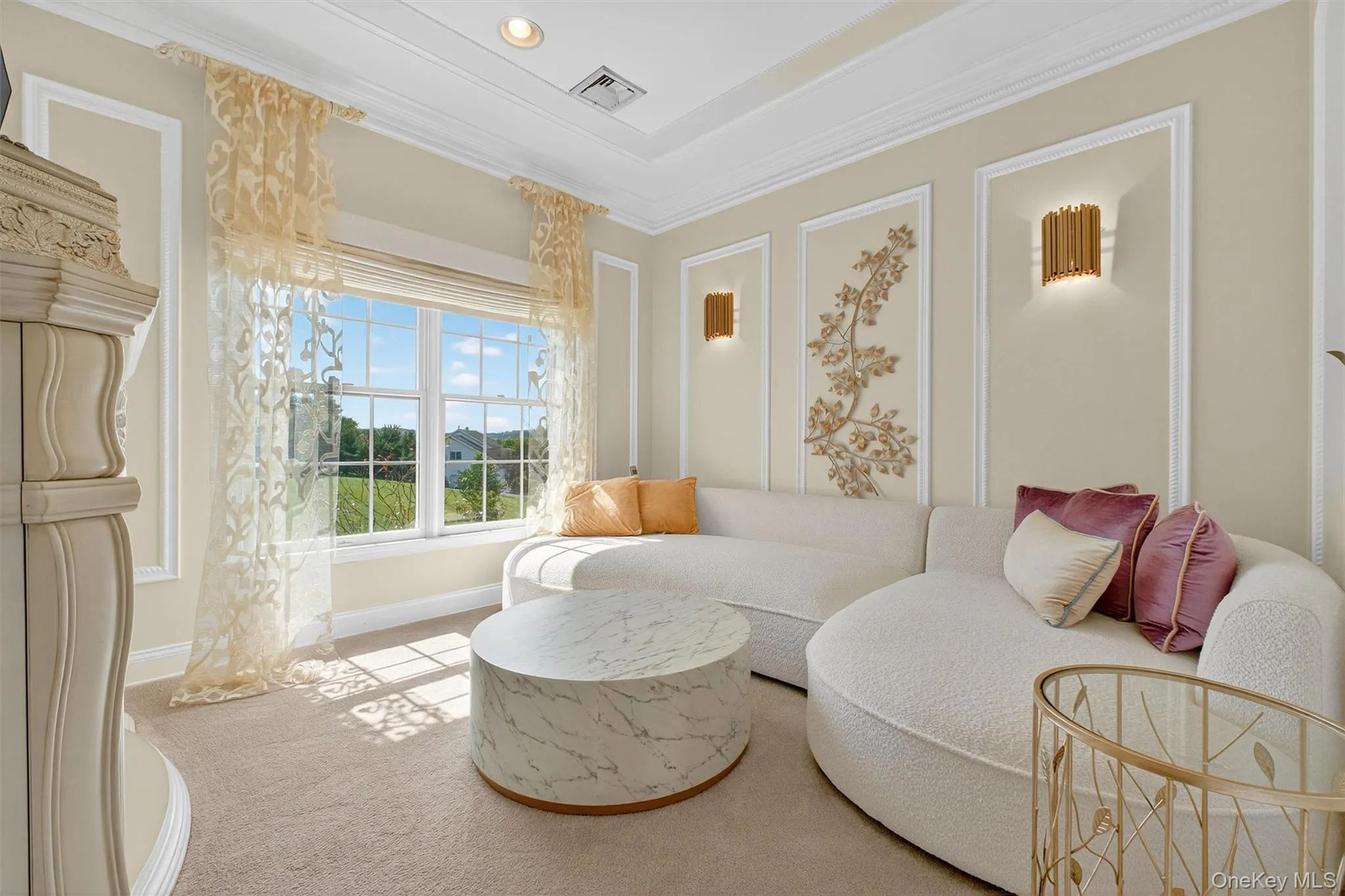 This inviting sitting room is the perfect complement to the master suite, offering a spacious and private retreat within the retreat. Custom molding and triple crown detailing elevate the design, while abundant natural light pours in through large windows dressed with custom blinds and drapery for both elegance and comfort. Generous in size, this space is ideal for quiet reading, morning coffee, or simply unwinding in privacy, making it a luxurious extension of the suite’s timeless charm. This inviting sitting room is the perfect complement to the master suite, offering a spacious and private retreat within the retreat. Custom molding and triple crown detailing elevate the design, while abundant natural light pours in through large windows dressed with custom blinds and drapery for both elegance and comfort. Generous in size, this space is ideal for quiet reading, morning coffee, or simply unwinding in privacy, making it a luxurious extension of the suite’s timeless charm.