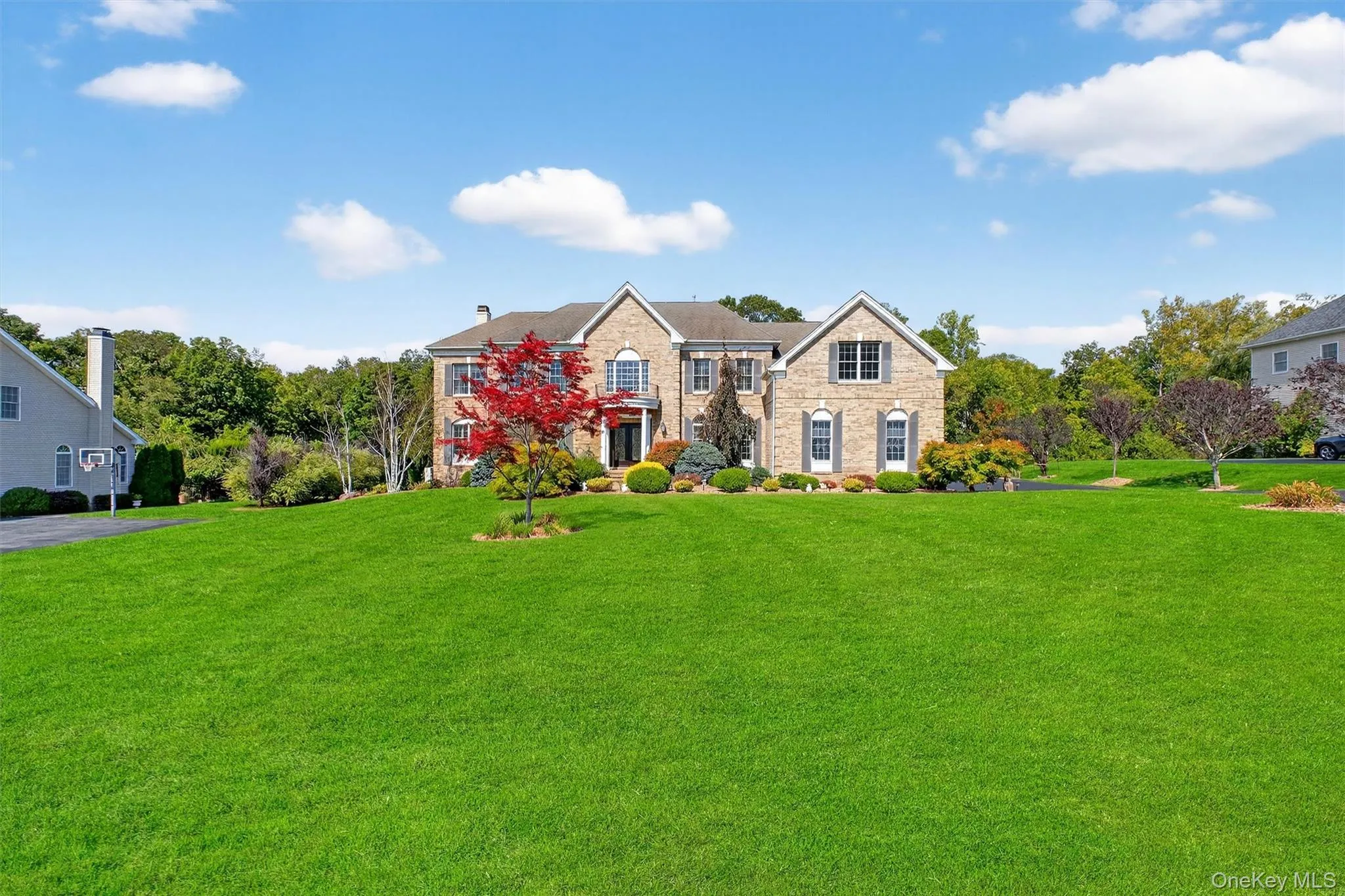 From above, the full majesty of this nearly 1-acre corner estate is revealed. Perfectly situated at the edge of the community, the property is bordered by mature woodlands, offering unmatched privacy and scenic natural views. The home sits at the center of expansive, manicured grounds, with a long private driveway enhancing its stately presence. The backyard emerges as the crown jewel—a masterfully designed oasis that blends structured elegance with open green space. With its thoughtful layout and prime orientation, this estate delivers a rare combination of seclusion, sophistication, and space to expand or personalize further.This is more than a home—it’s a statement of lifestyle, luxury, and location. From above, the full majesty of this nearly 1-acre corner estate is revealed. Perfectly situated at the edge of the community, the property is bordered by mature woodlands, offering unmatched privacy and scenic natural views. The home sits at the center of expansive, manicured grounds, with a long private driveway enhancing its stately presence. The backyard emerges as the crown jewel—a masterfully designed oasis that blends structured elegance with open green space. With its thoughtful layout and prime orientation, this estate delivers a rare combination of seclusion, sophistication, and space to expand or personalize further.This is more than a home—it’s a statement of lifestyle, luxury, and location.