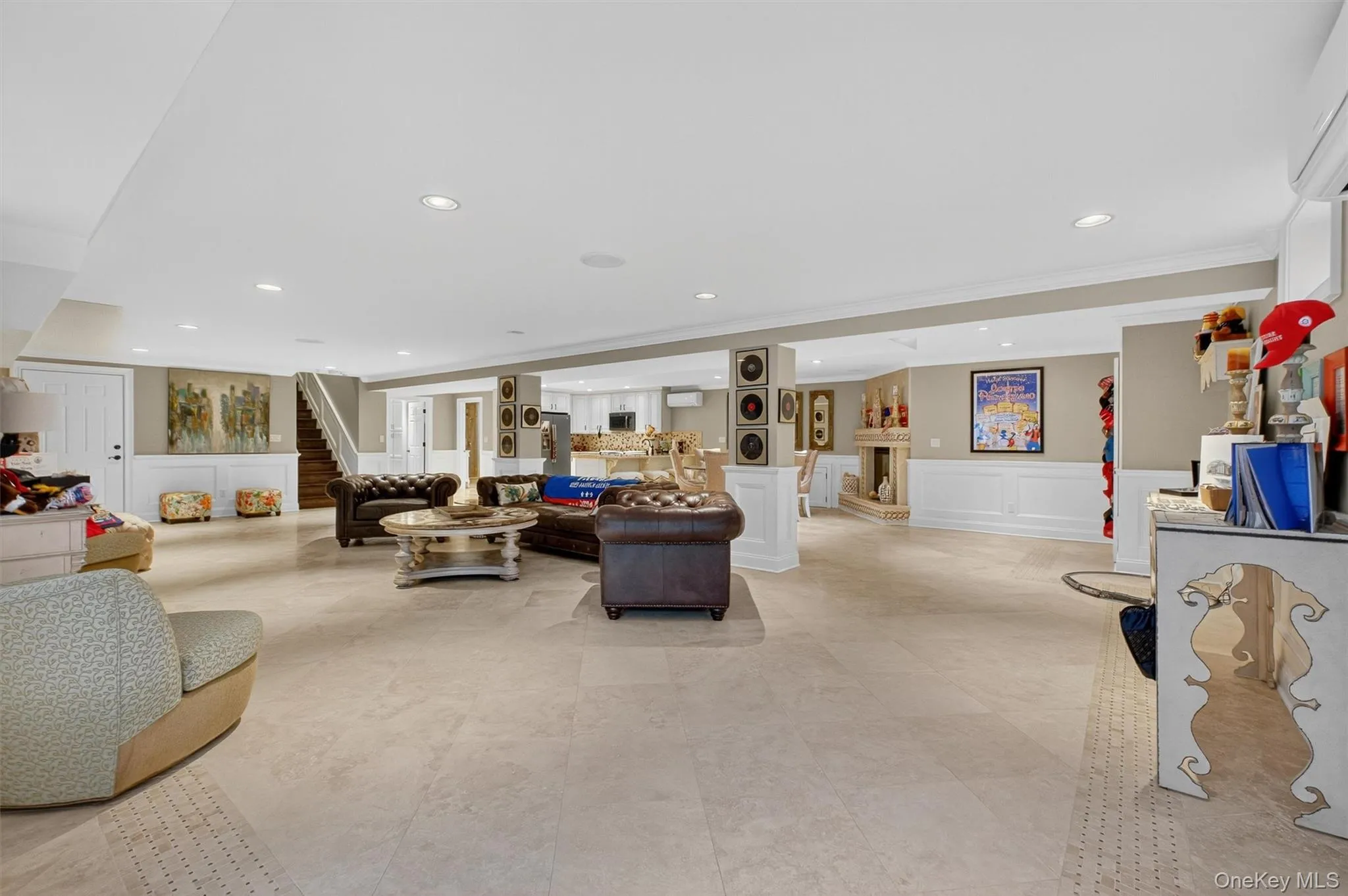 This expansive walkout basement offers over 1,700 sq. ft. of versatile living space, perfectly designed for in-law or multi-generational living. A full upgraded kitchen with custom cabinetry, quartz countertops, stainless appliances, and bar seating anchors the open layout, while limestone-patterned floors, recessed lighting, surround sound, and custom wood paneling elevate the style. The spacious living and dining areas are warmed by a decorative electric fireplace, with plenty of room for entertaining. A slider provides seamless access to the resort-style backyard and pool, making this the ultimate retreat for hosting family and friends. Complete with its own full bathroom, secondary laundry, and private heat/AC zone, this level is both luxurious and fully self-sufficient—an entertainer’s dream. This expansive walkout basement offers over 1,700 sq. ft. of versatile living space, perfectly designed for in-law or multi-generational living. A full upgraded kitchen with custom cabinetry, quartz countertops, stainless appliances, and bar seating anchors the open layout, while limestone-patterned floors, recessed lighting, surround sound, and custom wood paneling elevate the style. The spacious living and dining areas are warmed by a decorative electric fireplace, with plenty of room for entertaining. A slider provides seamless access to the resort-style backyard and pool, making this the ultimate retreat for hosting family and friends. Complete with its own full bathroom, secondary laundry, and private heat/AC zone, this level is both luxurious and fully self-sufficient—an entertainer’s dream.