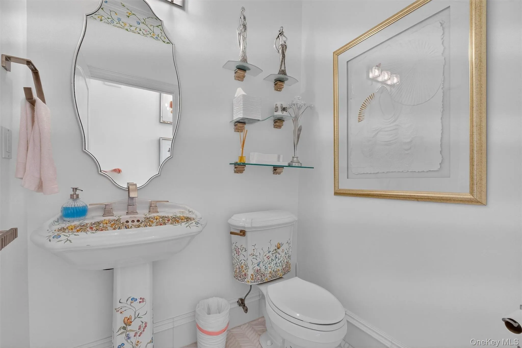 This oversized powder room, conveniently located off the entrance hallway near the family room, offers both generous space and refined elegance. Step onto a stunning herringbone-patterned floor that sets the tone for luxury, it features exquisitely stenciled floral fixtures that bring a sophisticated, artistic touch. The upgraded, high-end light fixtures illuminate the space with a warm, inviting glow, further elevating the ambience. A stylish vanity with bronze hardware completes the look, blending classic charm with modern refinement. Freshly painted in a soft, neutral palette, this lavish half bath is ideal for guests and everyday living, seamlessly combining beauty and practicality. This oversized powder room, conveniently located off the entrance hallway near the family room, offers both generous space and refined elegance. Step onto a stunning herringbone-patterned floor that sets the tone for luxury, it features exquisitely stenciled floral fixtures that bring a sophisticated, artistic touch. The upgraded, high-end light fixtures illuminate the space with a warm, inviting glow, further elevating the ambience. A stylish vanity with bronze hardware completes the look, blending classic charm with modern refinement. Freshly painted in a soft, neutral palette, this lavish half bath is ideal for guests and everyday living, seamlessly combining beauty and practicality.