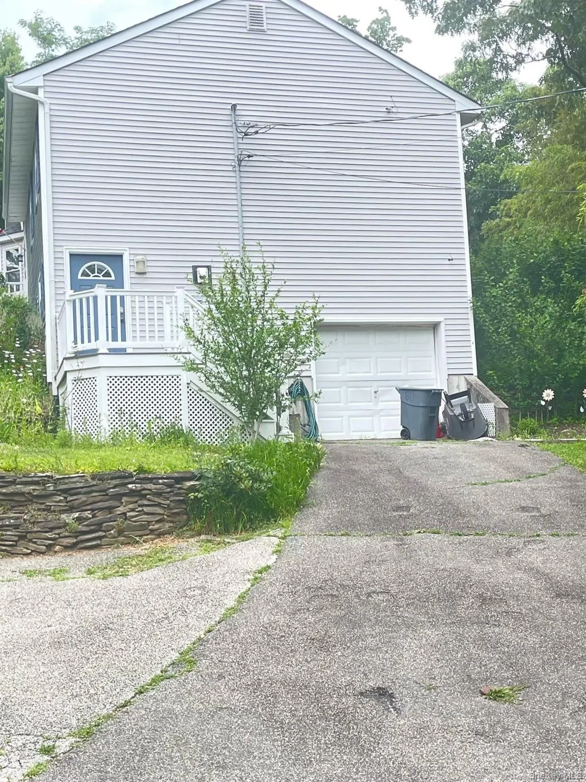 View of side of property with an attached garage View of side of property with an attached garage